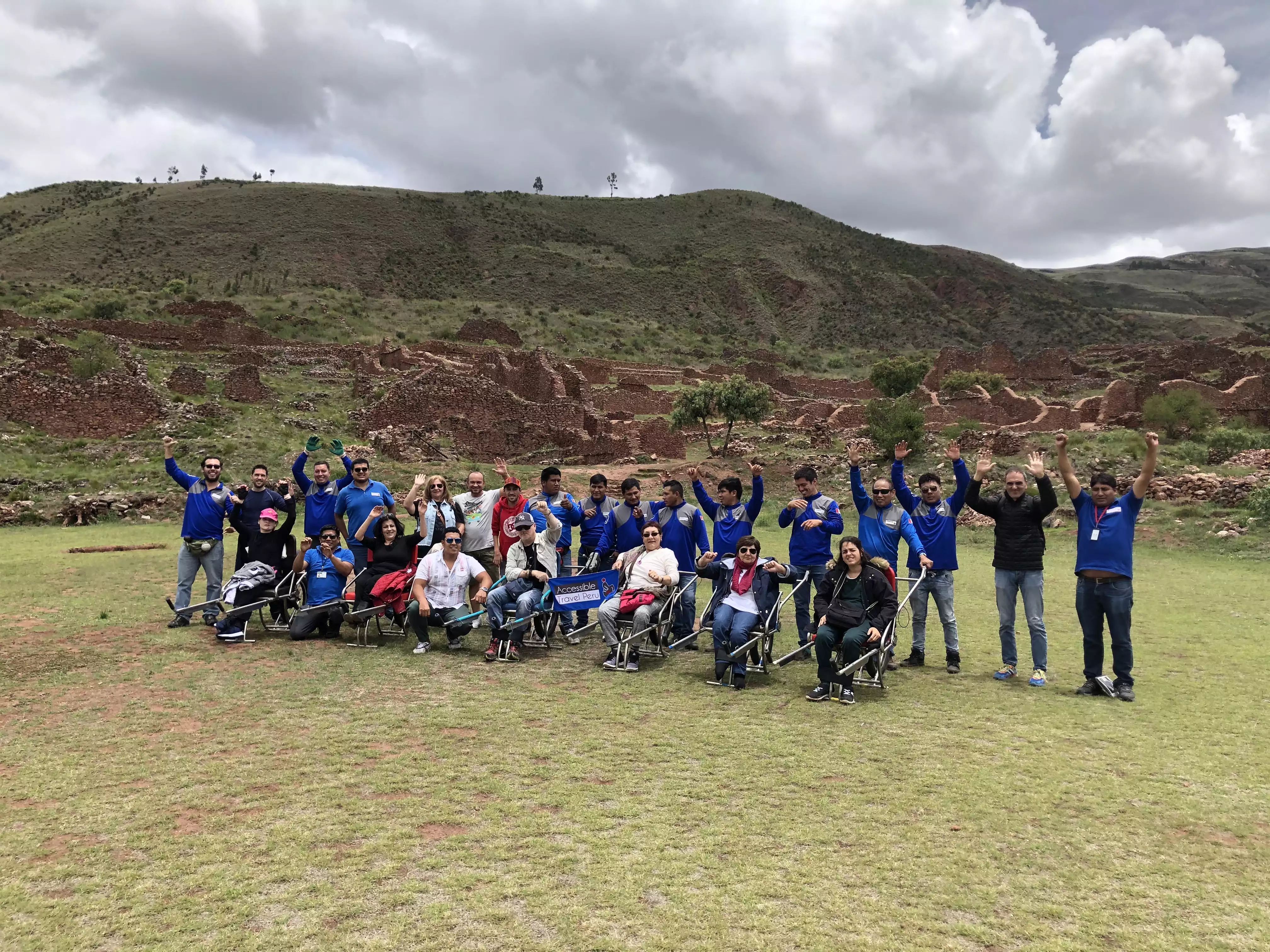Group of travelers including wheelchair users in scenic Peru